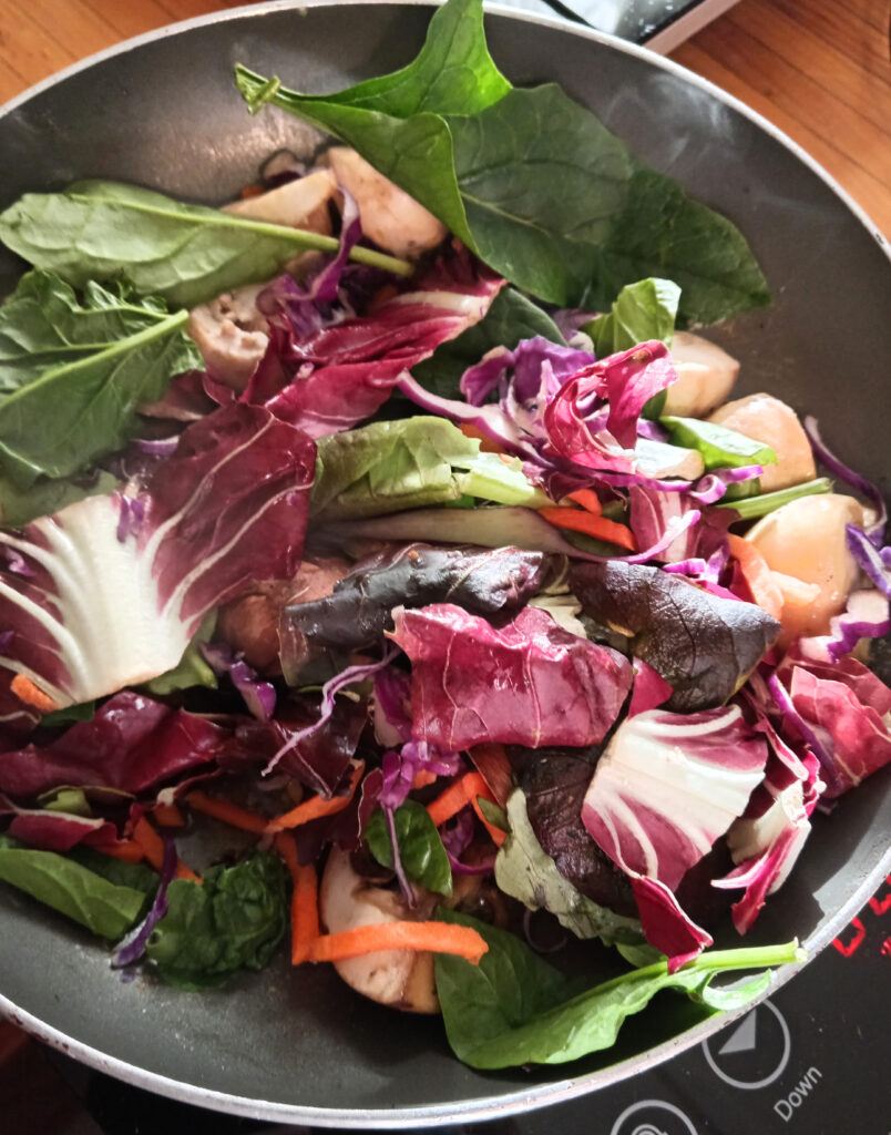 Mixed vegetables cooking in a frying pan for breakfast
