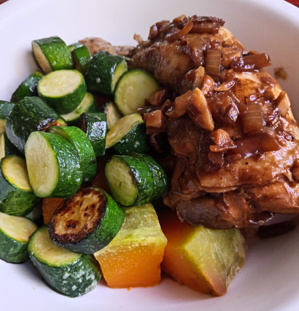 Chicken adobo with steamed pumpkin, pan-fried baby marrows, and a rich coconut adobo sauce.