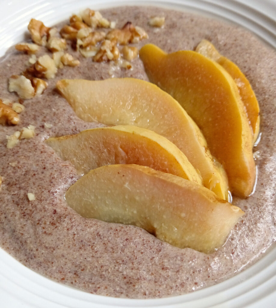 Keto-style Maltabella flaxseed porridge topped with poached quince slices and chopped walnuts