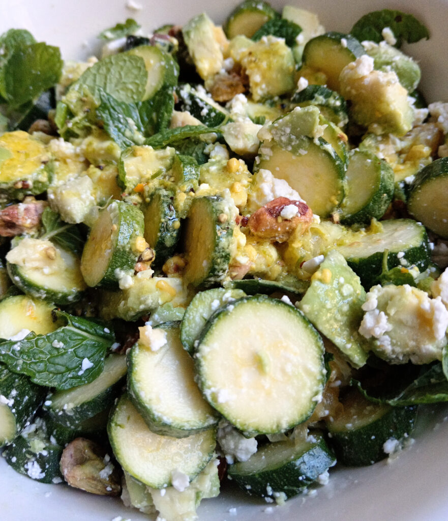 Baby marrow salad with avocado, feta, pistachios, mint and orange in a lime dressing.